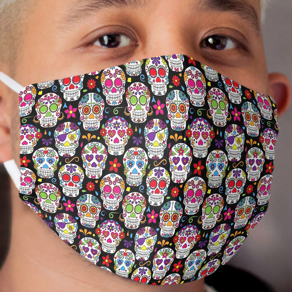 brightly colored sugar skulls on a black background Cloth Face Mask