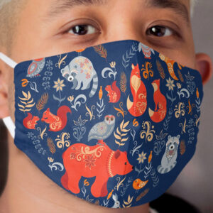 Fairy-tale forest. Fox, bear, raccoon, owls, rabbits, flowers and herbs on a blue background. Cloth Face Mask